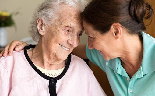 Dementia and Occupational Therapy - Home caregiver and senior adult woman