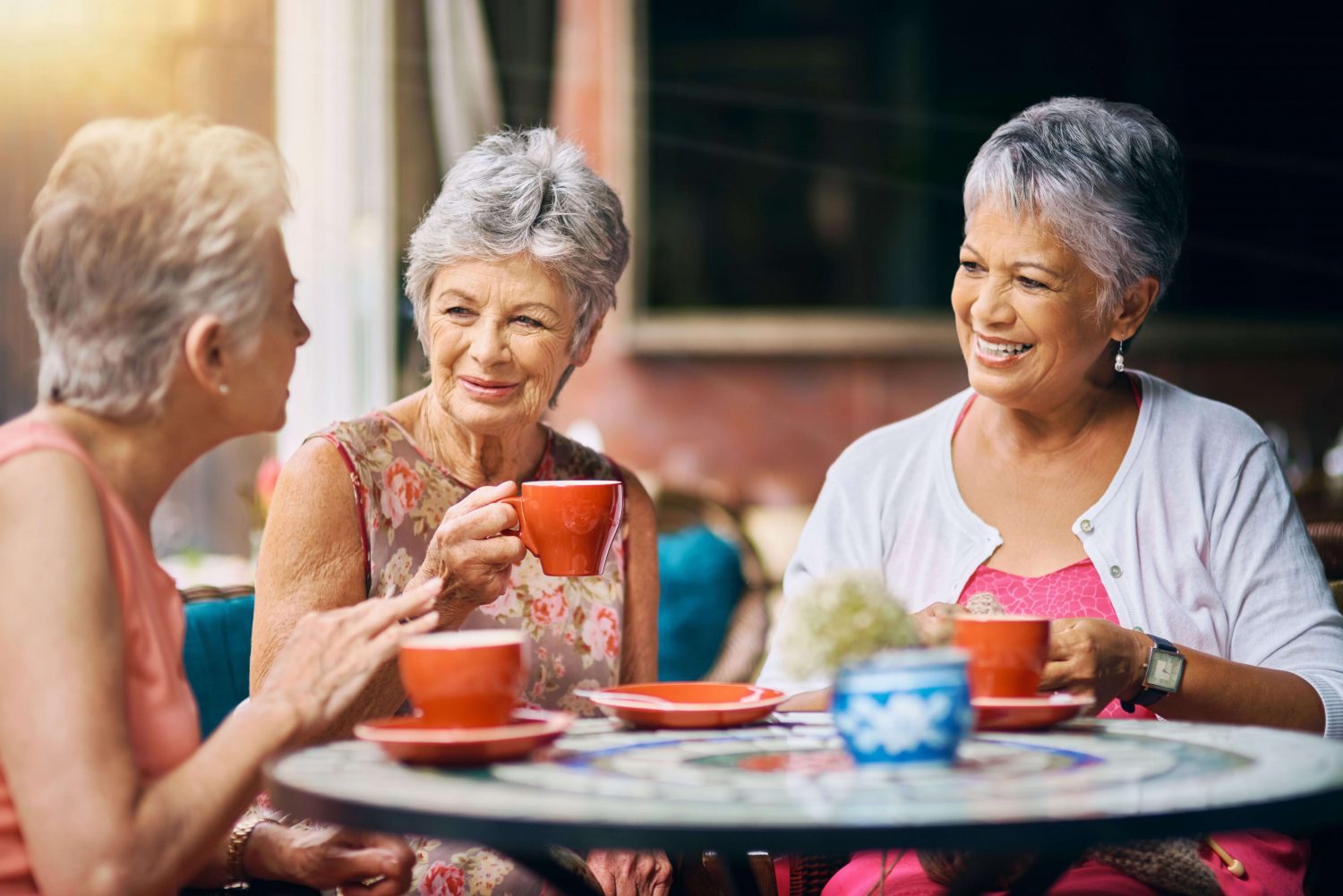 A group of women enjoy coffee ouside