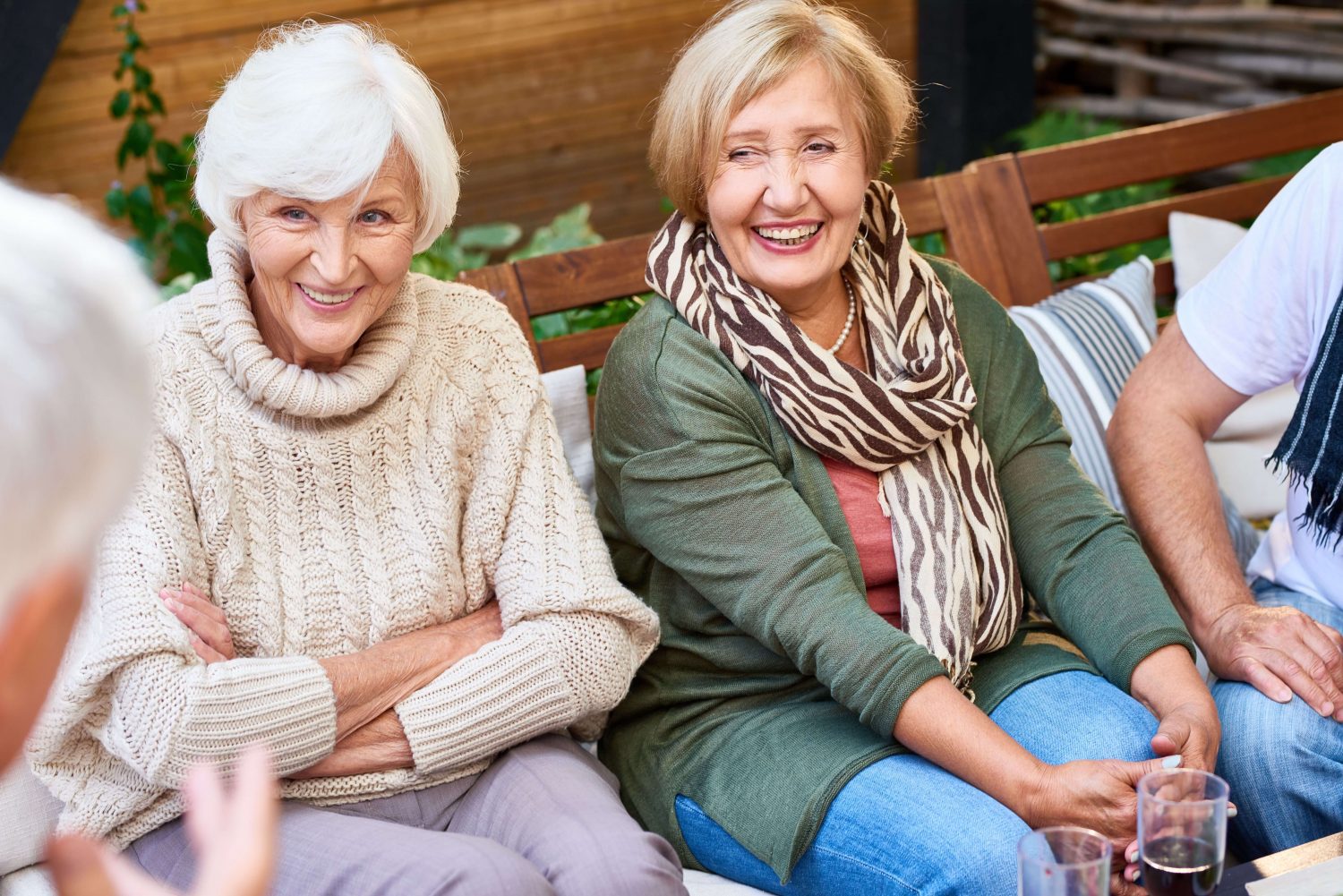people socializing on a bench