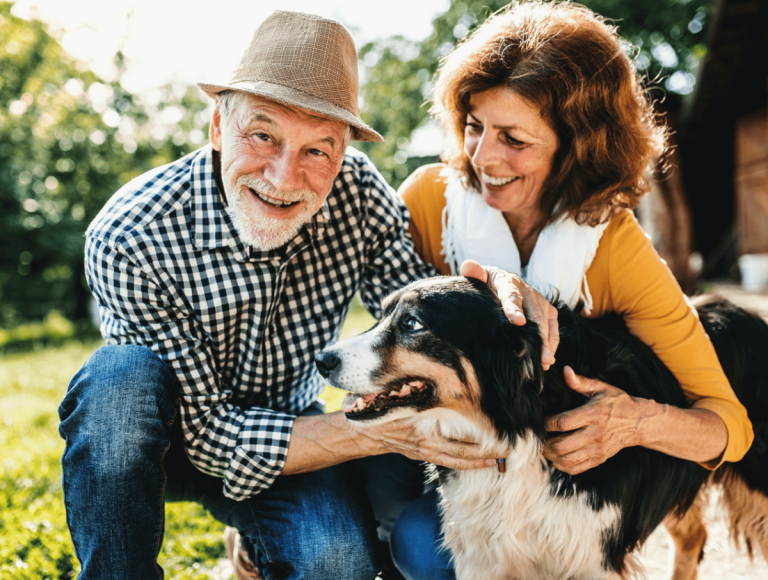 Couple with Australian Shepherd