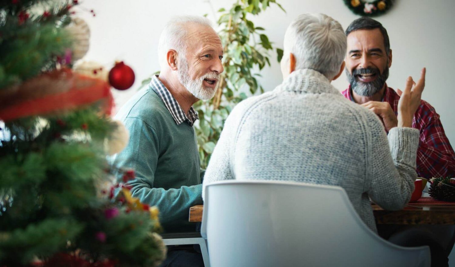 Family Celebrating Christmas at a Dining Room Table