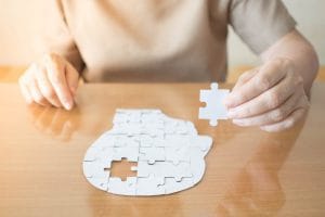 Senior trying to put a puzzle together