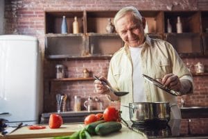 Older adult preparing a healthy summer recipe