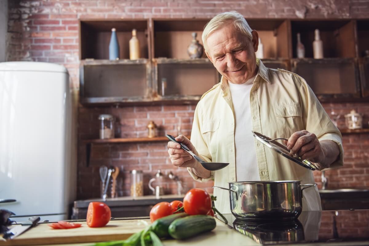 Older adult preparing a healthy summer recipe