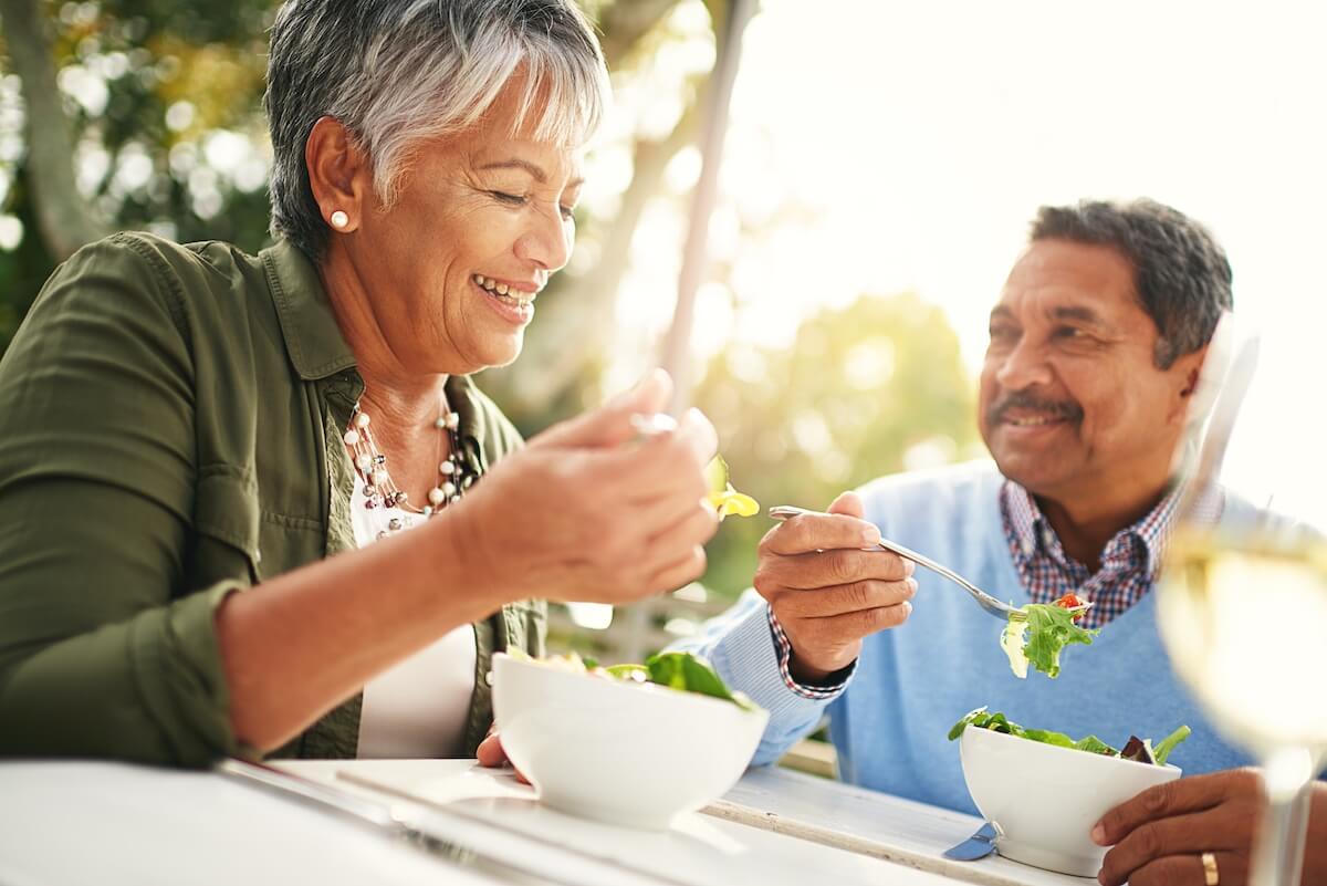 eating black couple healthy - Rockbridge Oaks An older couple enjoying a healthy salad in the summer