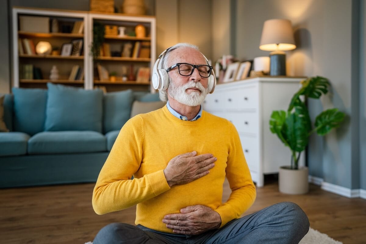 Older adult meditating at home - Rockbridge Oaks Older adult meditating at home